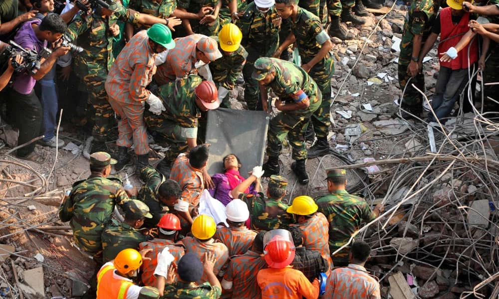 Rescue workers pull survivors from the Rana Plaza wreckage