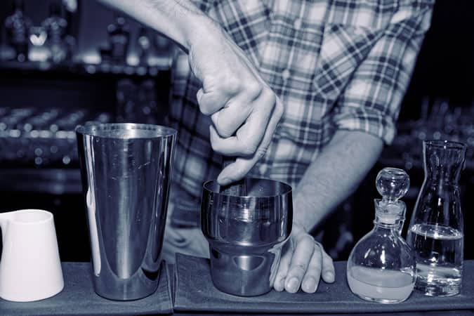 Muddling ingredients for a cocktail