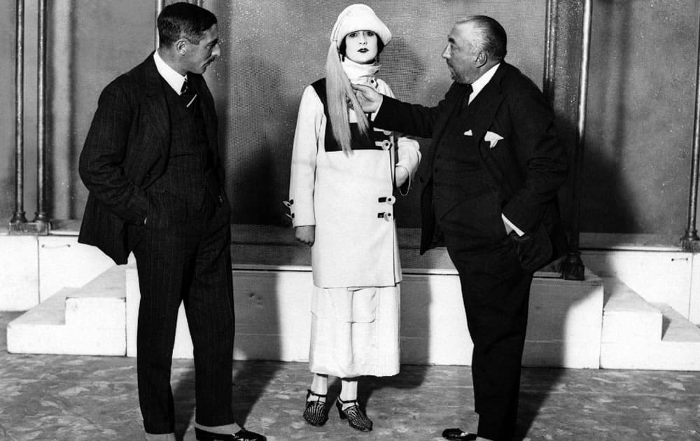 Paul Poiret, with a client, in his studio