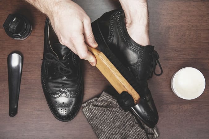 Man Polishing His Shoes