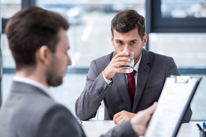 Accept a drink during an interview