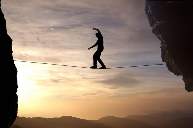 Man walking tightrope