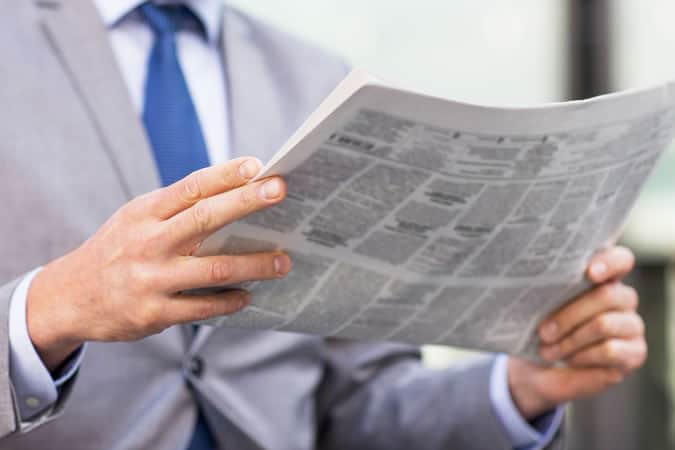 Man reading newspaper