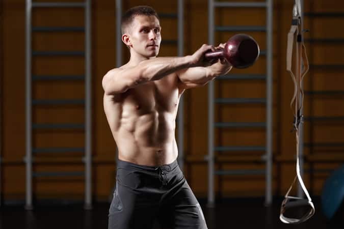 Man doing kettlebell circuit