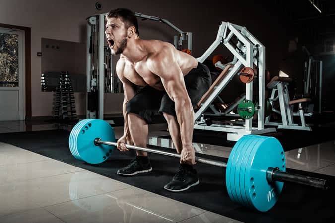 Man deadlifting