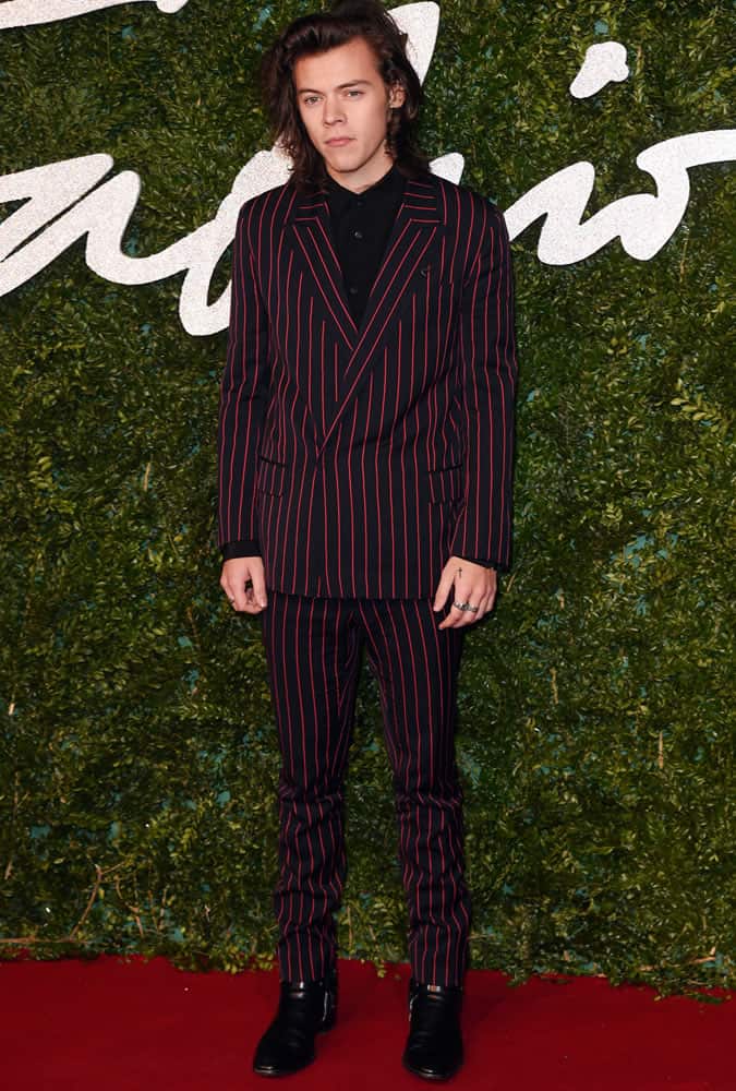 Harry Styles wearing red and black striped suit
