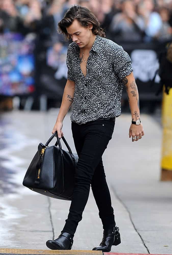 Harry Styles wearing black and white shirt