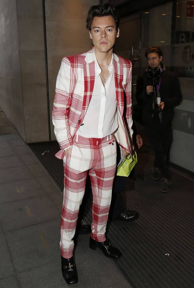 Harry Styles wearing red and cream check suit