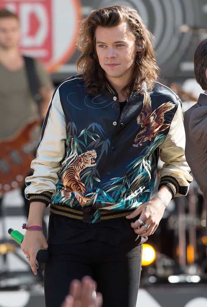 Harry Styles wearing a souvenir jacket