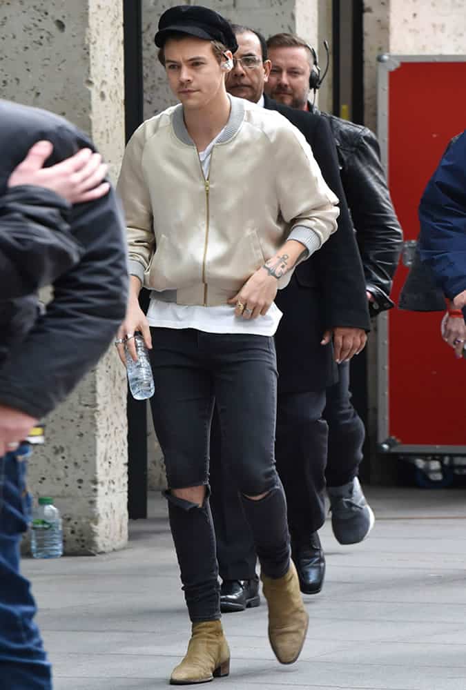 Harry Styles wearing a bomber jacket