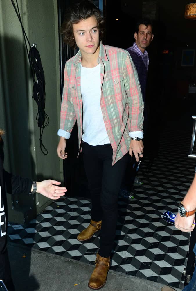 Harry Styles wearing a colourful check shirt