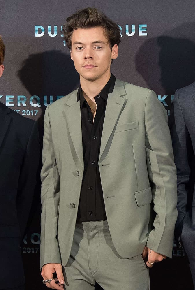 Harry Styles wearing a green suit at the Dunkirk premiere
