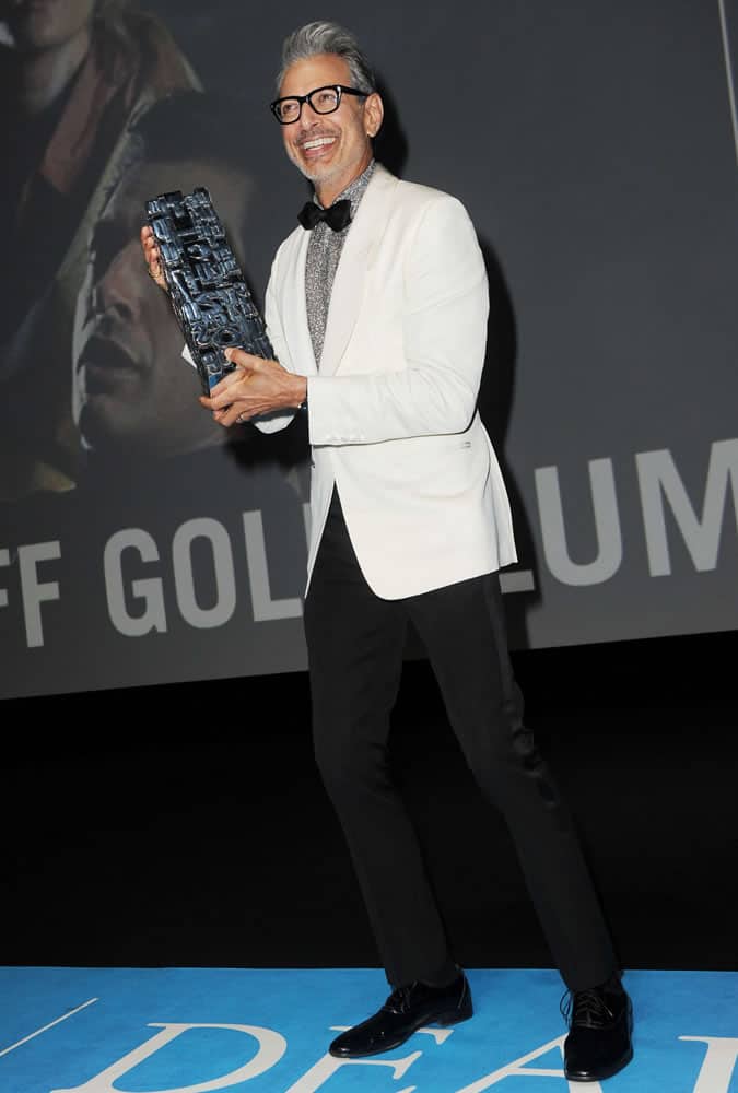 Jeff Goldblum pictured in a white dinner jacket at the Paris premiere of Kidnap