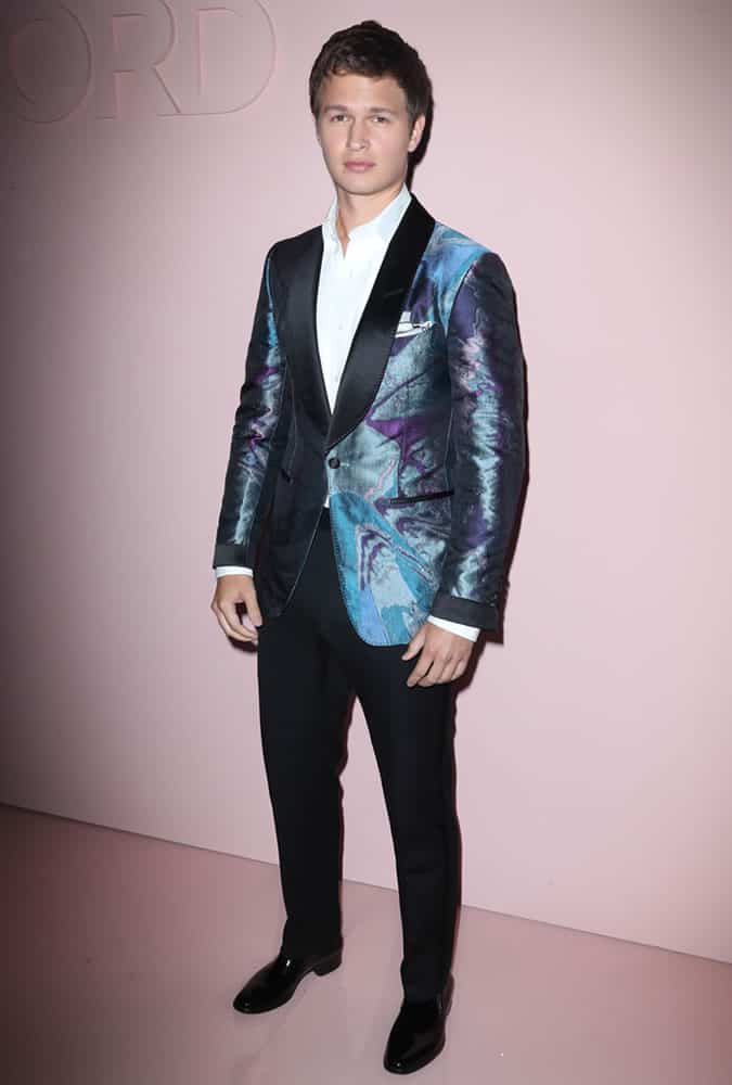 Ansel Elgort wearing an iridescent dinner jacket at the Tom Ford show at New York Fashion Week