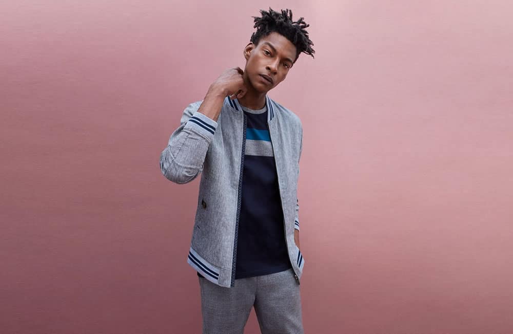Ted Baker sports luxe look with tailored trousers and a bomber jacket
