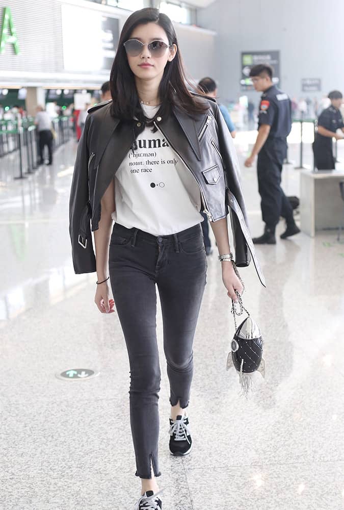 Min Xi wearing a leather jacket