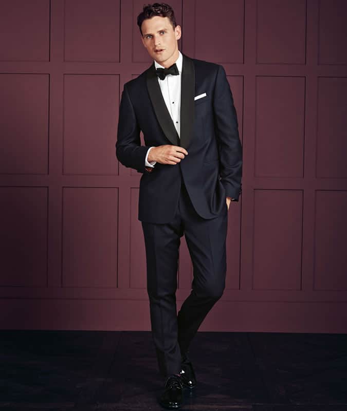 Midnight blue tuxedos actually look darker than black under artificial light