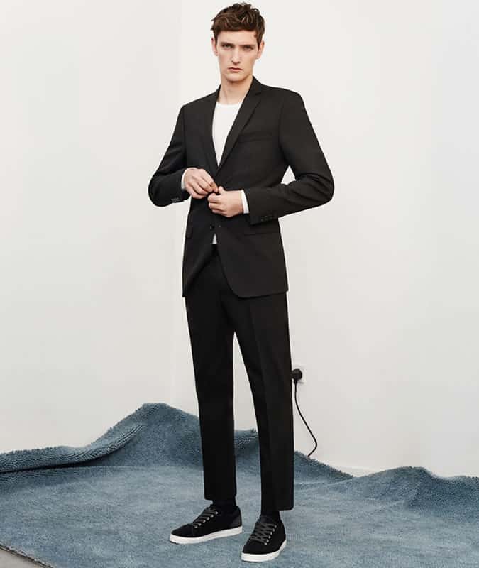 wearing a white t-shirt with a suit