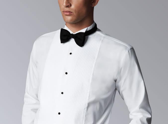 Man Wearing A Dress Shirt And Bow Tie