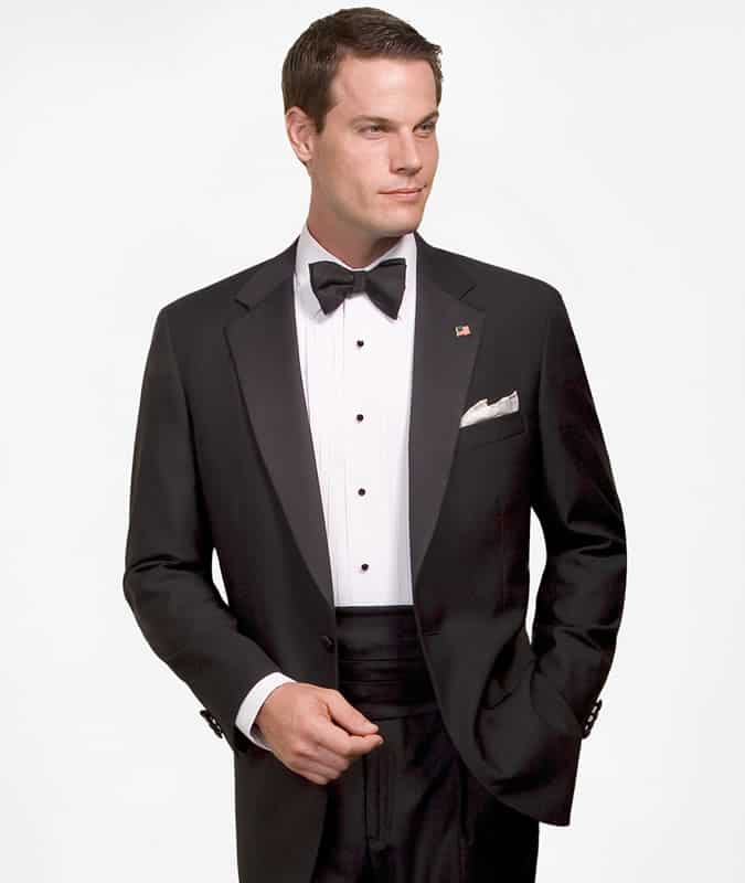 Man Wearing A Tuxedo And Cumberband