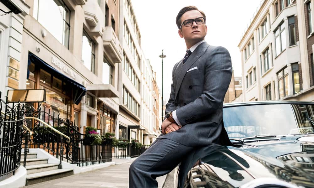 Taron Egerton Sat On A Car In Kingsman: The Golden Circle