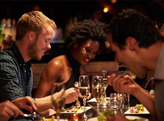 People Eating A Meal At A Restaurant