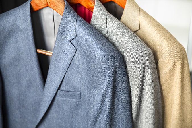 Suits Hanging In A Wardrobe