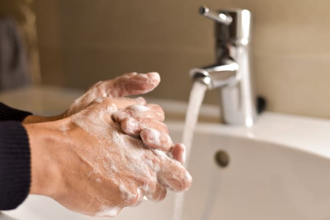 Man Washing His Hands