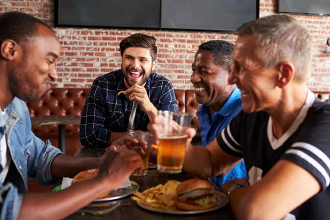 Men Drinking At A Bar