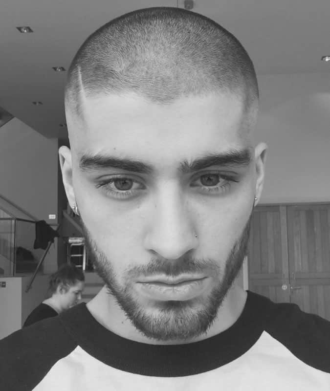 Buzz cut with a hard parting and fade