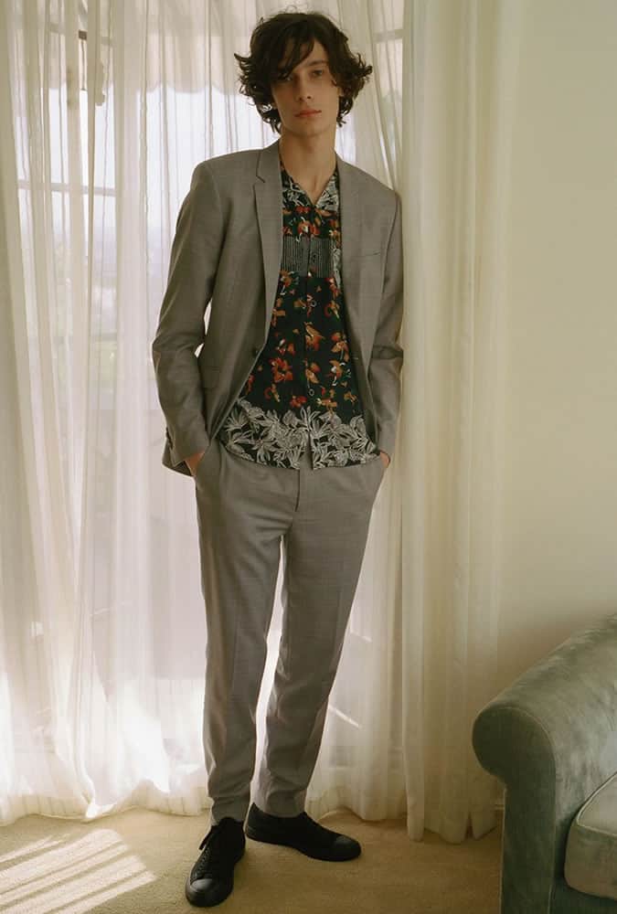 Man Wearing A Suit With A Patterned Shirt
