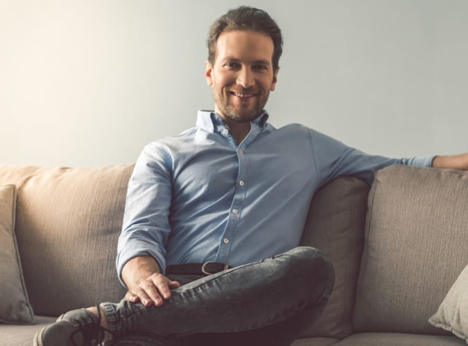 Man Sat Down Wearing A Shirt