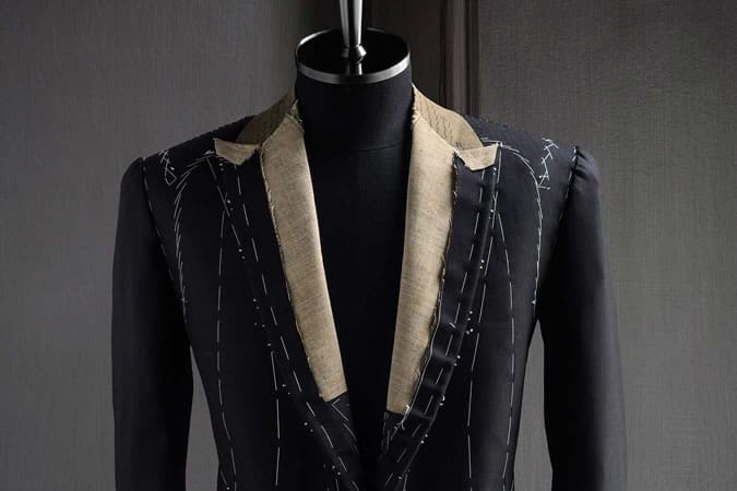 Bespoke suit on clothes horse