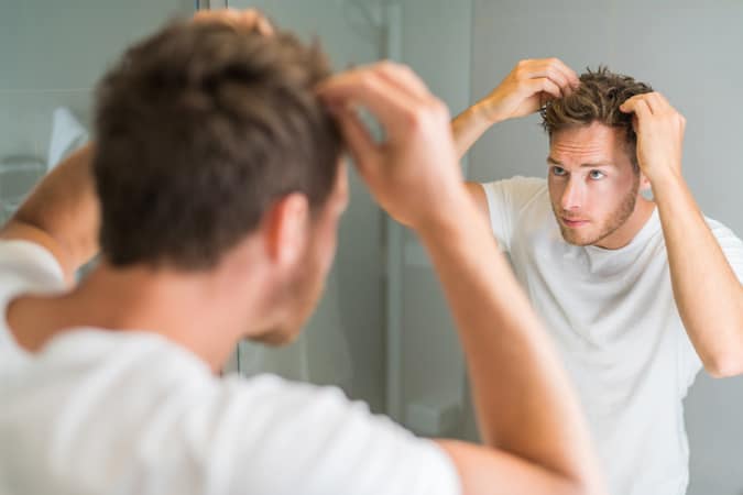 Man styling hair
