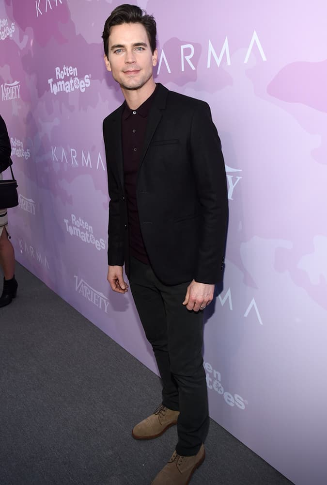 Matt Bomer Wearing A Suit With A Purple Polo Shirt