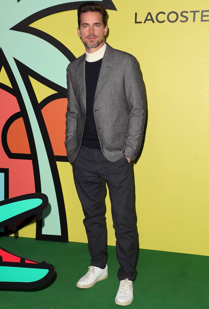 Matt Bomer Wearing A Suit With A White Roll Neck