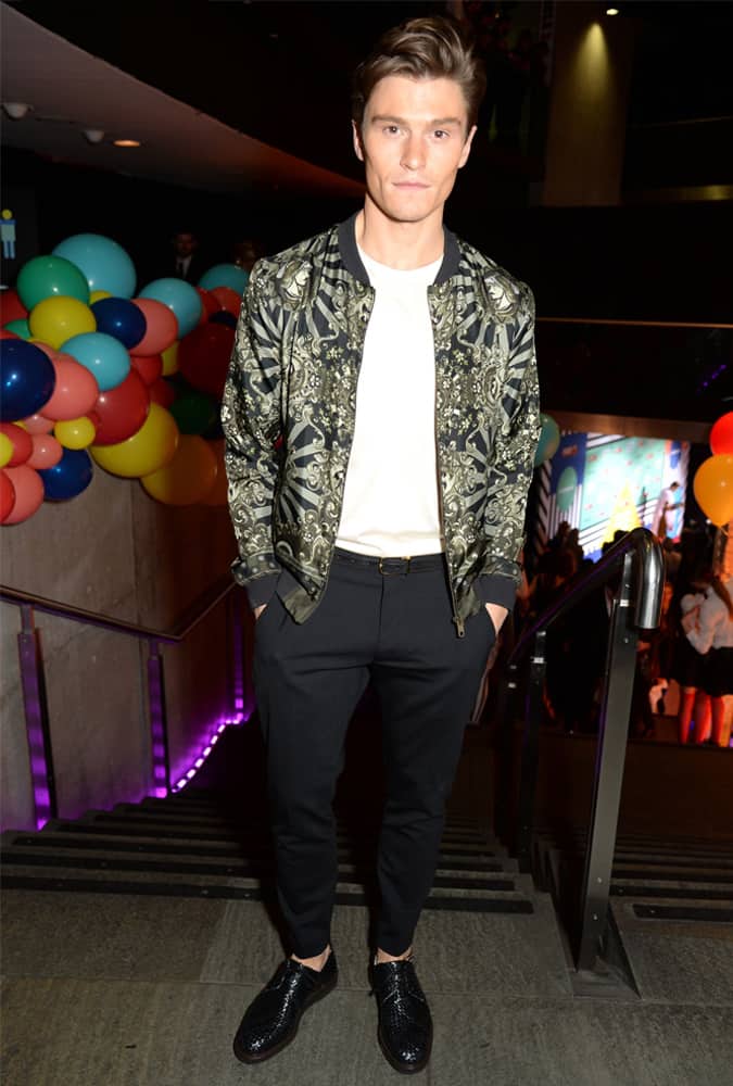 Oliver Cheshire Wearing A Patterned Bomber Jacket