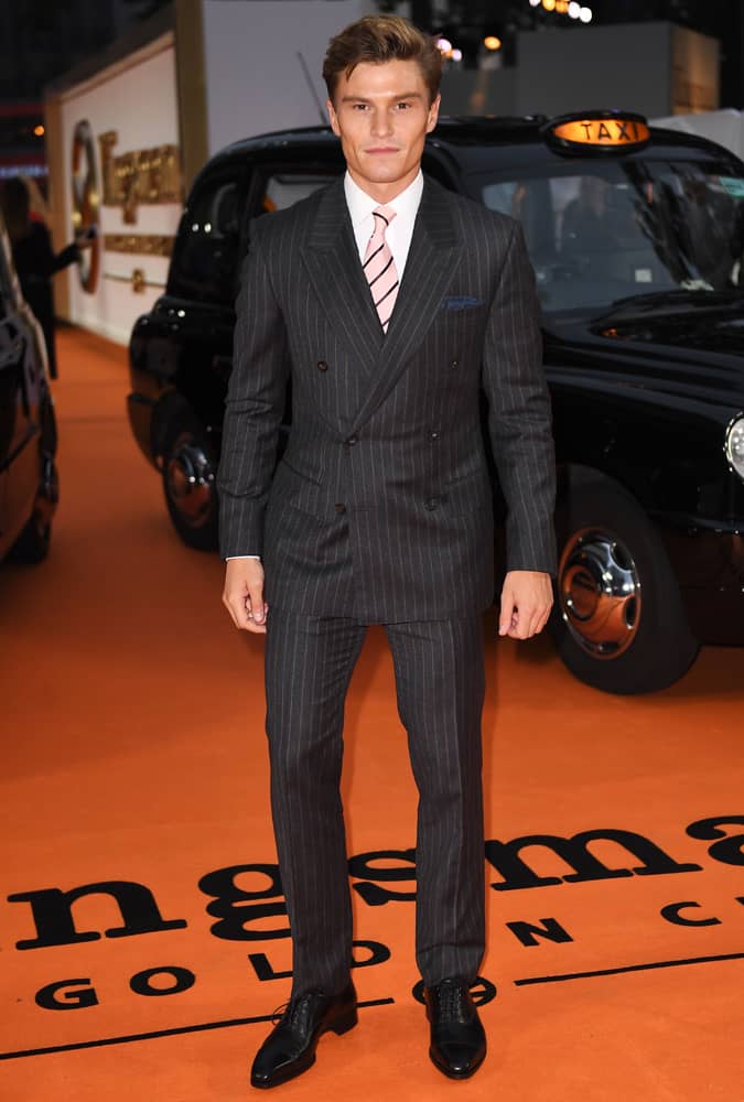 Oliver Cheshire Wearing A Pinstripe Suit