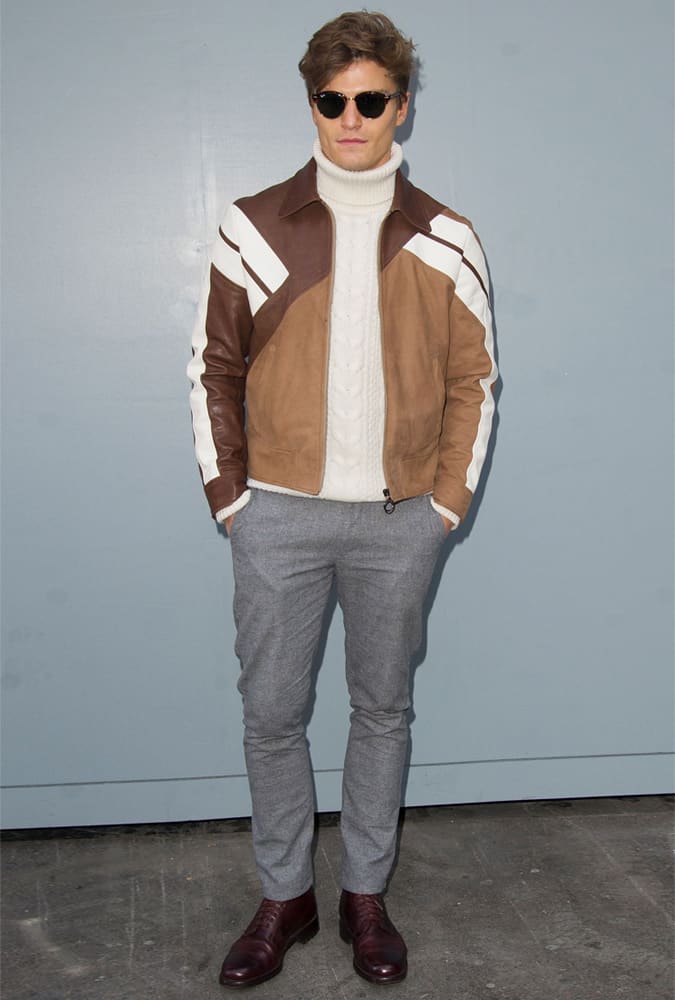 Oliver Cheshire Wearing A Cream Roll Neck
