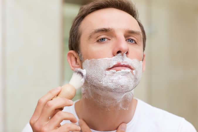 Man using shaving soap