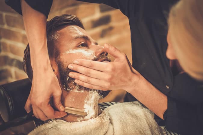 Man getting a cut throat shave