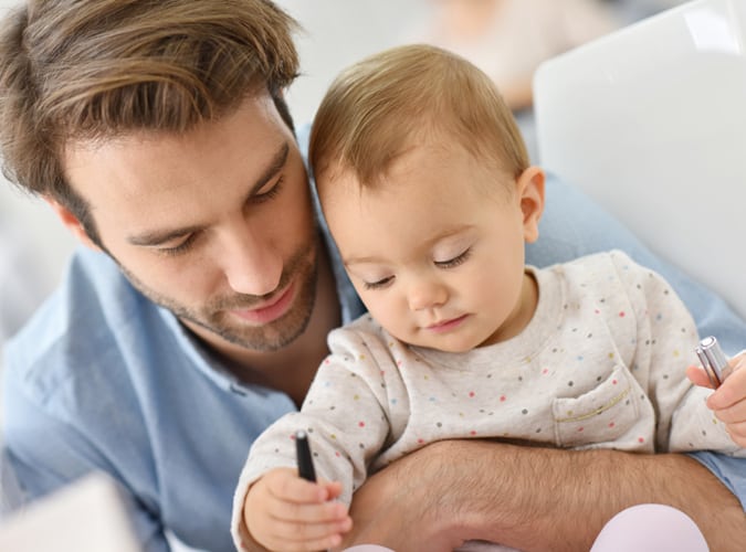man caring for baby
