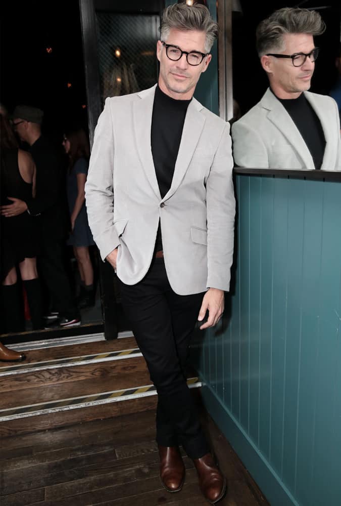 Eric Rutherford Wearing A Grey Blazer