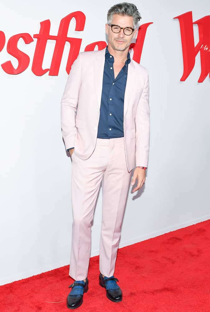 Eric Rutherford Wearing A Pink Suit