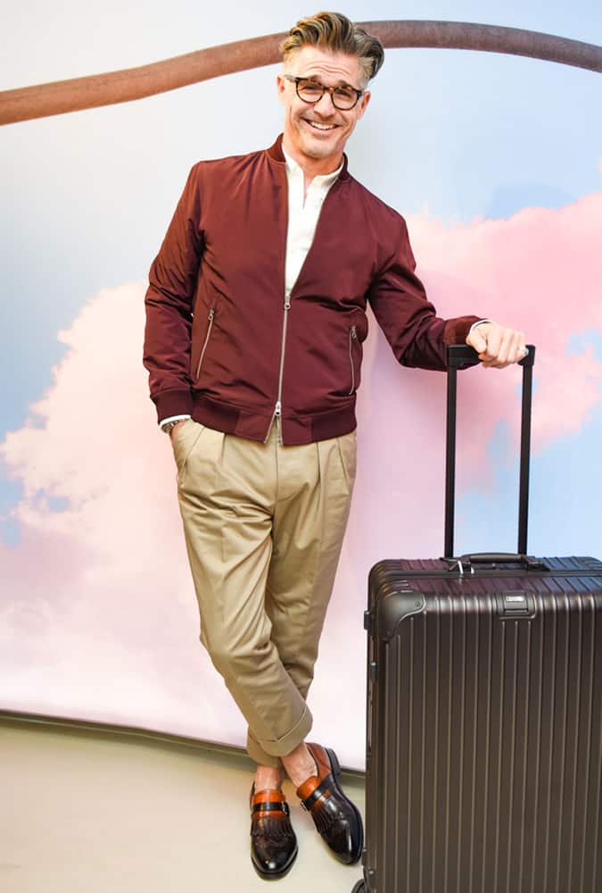 Eric Rutherford Wearing A Burgundy Bomber Jacket
