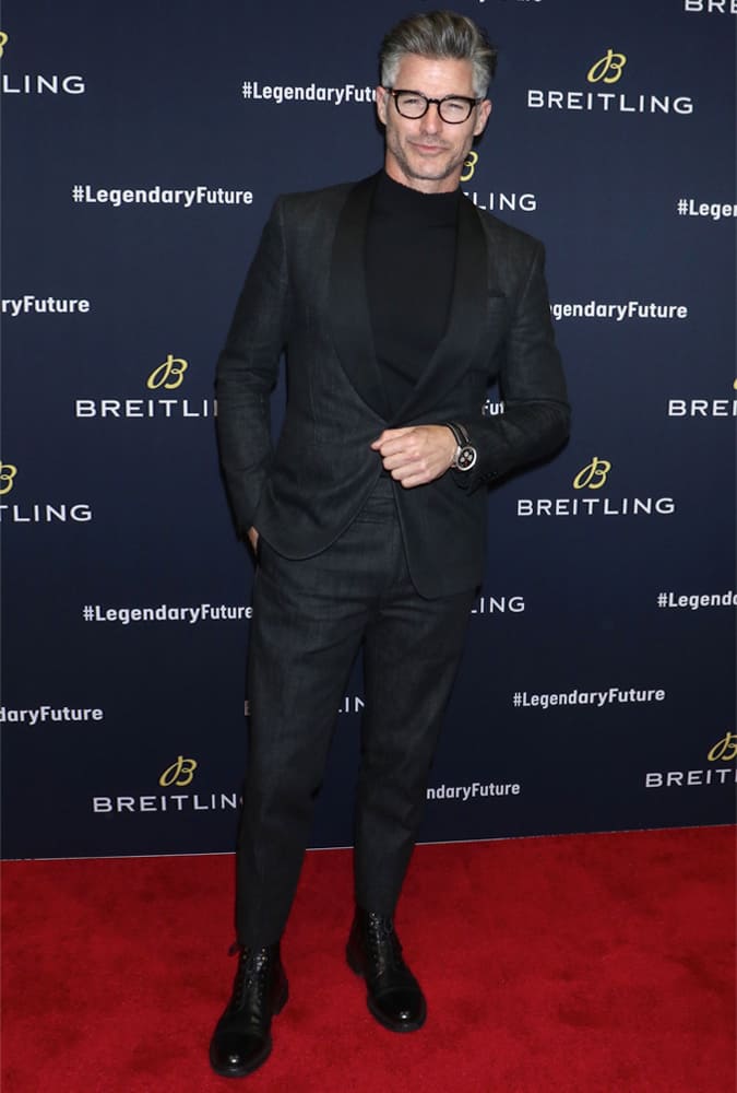 Eric Rutherford Wearing A Black Suit