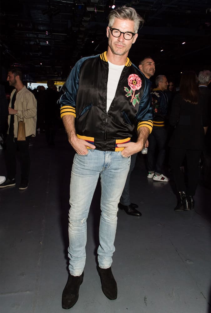 Eric Rutherford Wearing A Souvenir Jacket