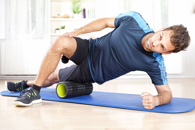 Man using foam roller