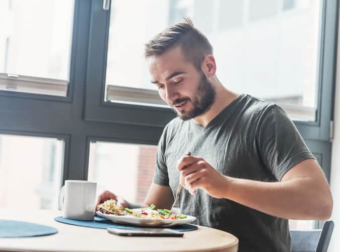 Man Eating A Healthy Meal