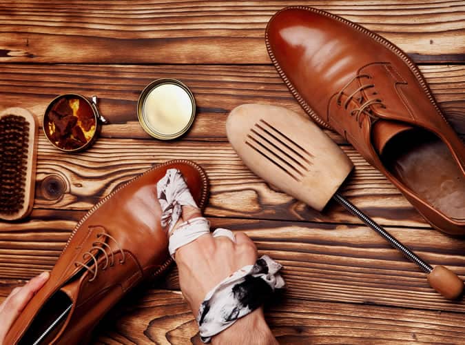 man shining shoes